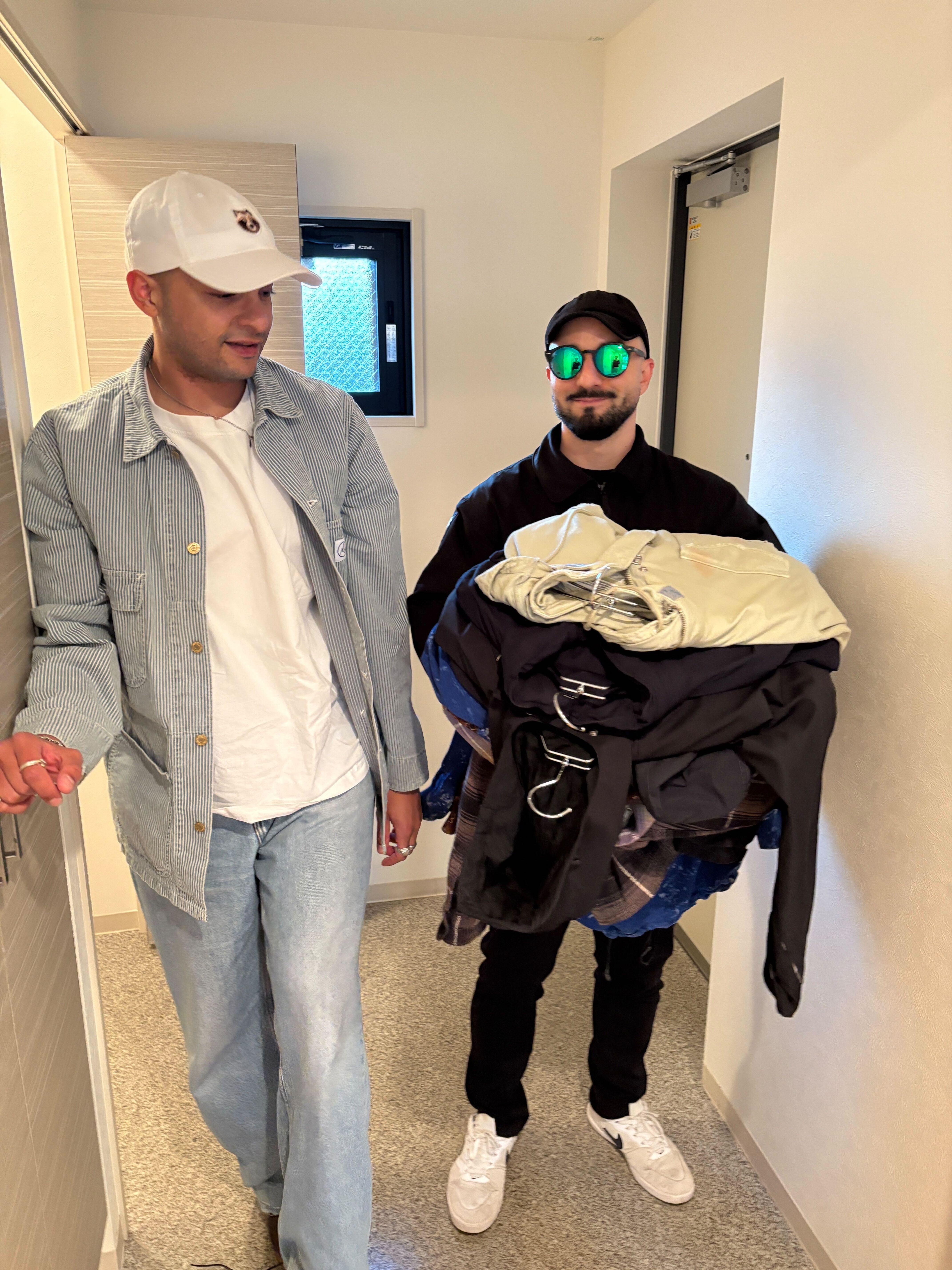 Standing in front of a meat-shop in Kagoshima, Japan